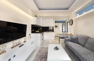 a living room with a couch and a table at Modern Colorful House 4 Rhodos in Rhodes Town