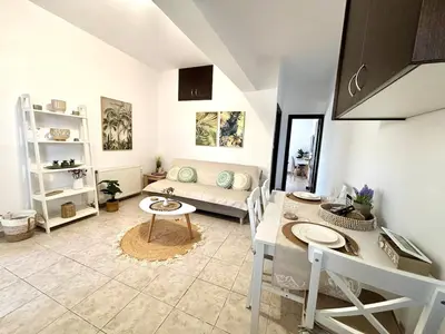 a living room with a couch and a table at Andreana's House Rhodes in Rhodes Town