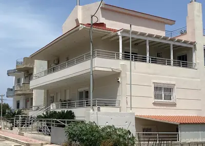 a white building with balconies on the side of it at Andreana's House Rhodes in Rhodes Town