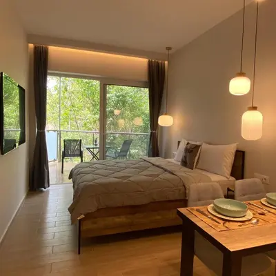 a bedroom with a bed and a table at SEAL of Deer - Castle View - 5 minute walk to the Beach in Rhodes Town