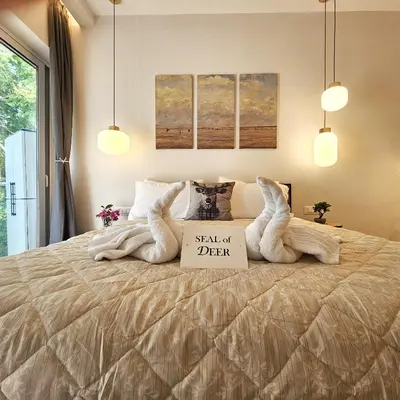 a bedroom with a bed with a sign on it at SEAL of Deer - Castle View - 5 minute walk to the Beach in Rhodes Town