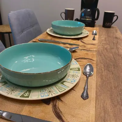 a table with two bowls and a plate with a spoon at SEAL of Deer - Castle View - 5 minute walk to the Beach in Rhodes Town