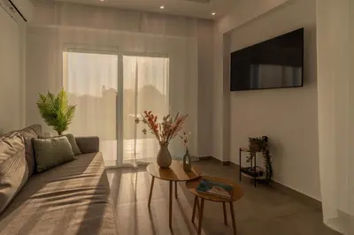 a living room with a couch and a table at Onda Blu in Rhodes Town