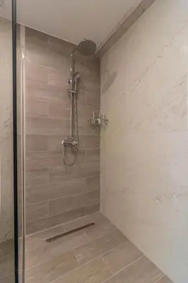 a shower stall with a glass door in a bathroom at Onda Blu in Rhodes Town