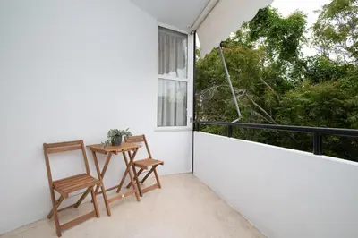 a balcony with a table and chairs and a window at Gravity Downtown Balcony Studio in Rhodes Town