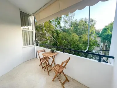 a balcony with two chairs and a table at Gravity Downtown Balcony Studio in Rhodes Town