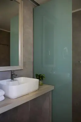 a bathroom with a white sink and a mirror at Sunrise Hotel in Pefki Rhodes