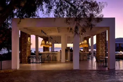 a pavilion with tables and chairs on a patio at Sunrise Hotel in Pefki Rhodes