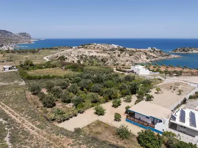 an aerial view of a house and the ocean at Laftiras Sea View Home in Archangelos
