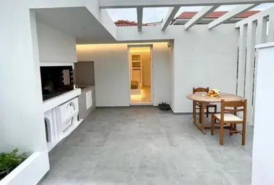 a kitchen with a table and a dining room at White House Luxury Apartment of Rhodes in Kremasti