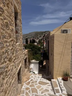 a view of a city from a stone building at Seaside escape in Symi