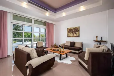 a living room with a couch and a table at Diamanti Villa Prime Location in Rhodes Town