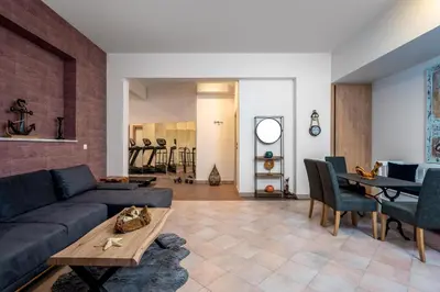 a living room with a couch and a table at Diamanti Villa Prime Location in Rhodes Town