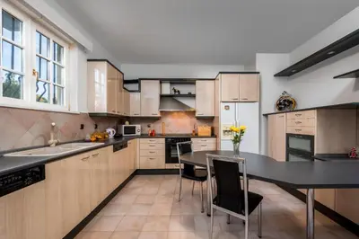 a kitchen with a table and a dining room at Diamanti Villa Prime Location in Rhodes Town