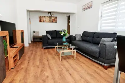 a living room with a couch and a table at Dionysus Apartment in Rhodes Town