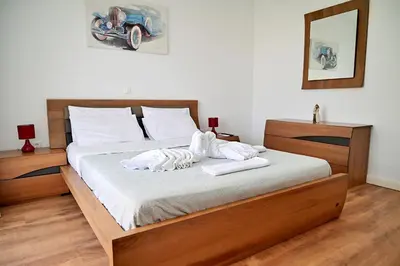 a bedroom with a bed with towels on it at Dionysus Apartment in Rhodes Town