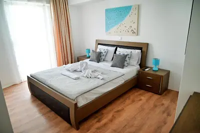 a bedroom with a bed with two towels on it at Dionysus Apartment in Rhodes Town