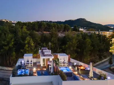 a view of a house with lights on at Sunny Nest Apartments in Ixia