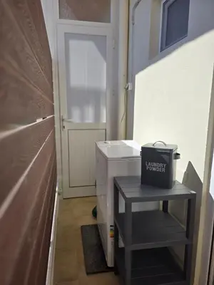a small bathroom with a black box on a table at The cozy nest in Rhodes in Rhodes Town