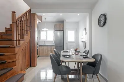 a dining room with a table and chairs at Casa Aurora Rhodes in Rhodes Town