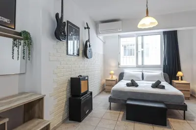 a bedroom with a bed and a tv in it at Casa Aurora Rhodes in Rhodes Town
