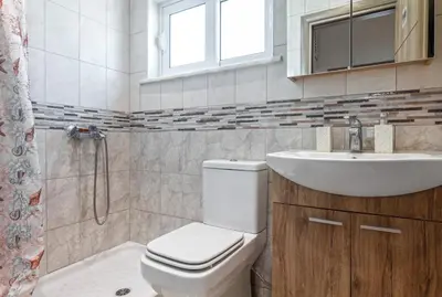 a bathroom with a toilet and a sink at Casa Aurora Rhodes in Rhodes Town