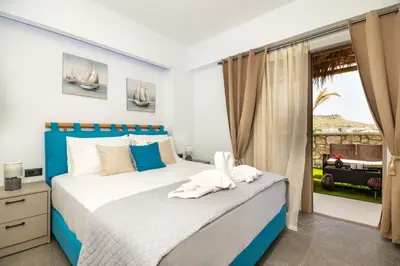 a bedroom with a bed and a window at Haraki Bliss in Haraki