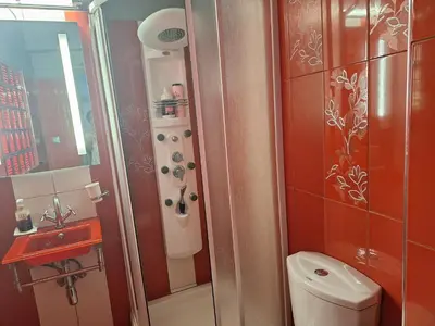 a bathroom with a shower and a toilet and a sink at Rhodos City in Rhodes Town