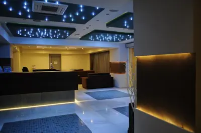 a lobby with a waiting room with blue lights at Sea Melody Beach Hotel Apartments in Ialyssos
