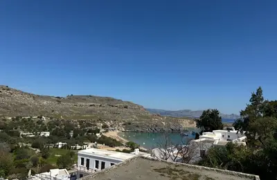 a view of a body of water from a city at Villa Kali in Líndos