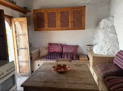 a living room with a couch and a table at Villa Kali in Líndos
