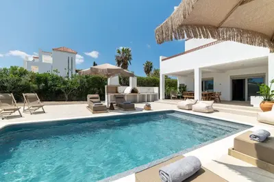 a villa with a swimming pool and a patio at Paradiso Luxury Beachfront Villa in Gennadi