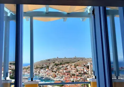 a view of a city from a window at Villa Panorama in Halki