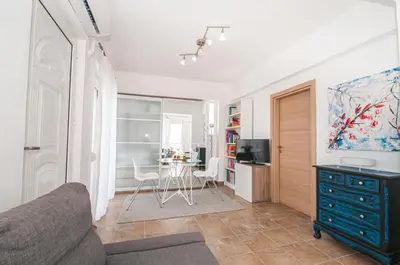 a living room with a couch and a table at Luna Loft in Rhodes Town