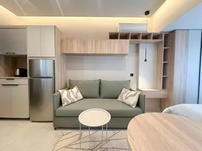 a living room with a couch and a table at Anna Tiny Apartments in Rhodes Town
