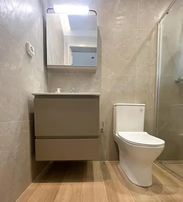 a bathroom with a toilet and a sink and a shower at Anna Tiny Apartments in Rhodes Town