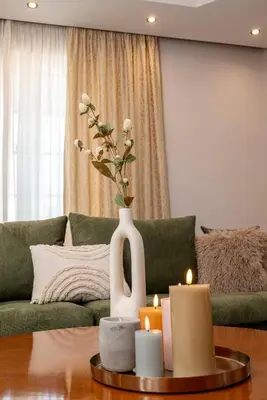 a living room with a vase with candles on a table at Maio Seaview & Sunset Stay in Kremasti Rhodes in Kremasti