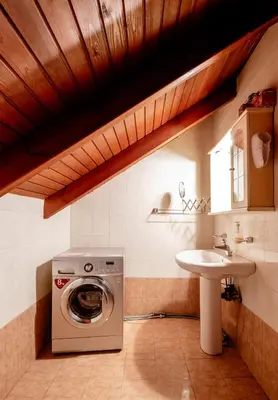 a bathroom with a washing machine and a sink at Marys House 2 in Rhodes Town