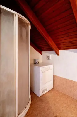 a kitchen with a washer and dryer in a room at Marys House 2 in Rhodes Town