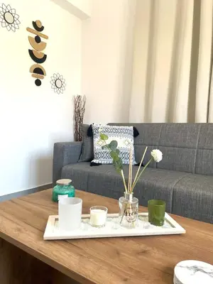 a coffee table in a living room with a couch at Vasilias House in Apóllona