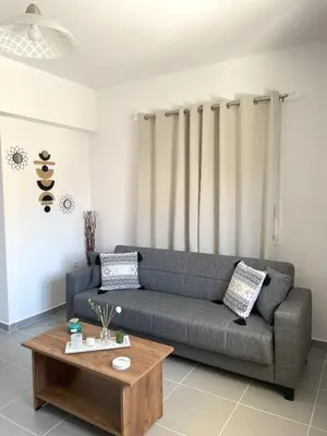 a living room with a couch and a coffee table at Vasilias House in Apóllona
