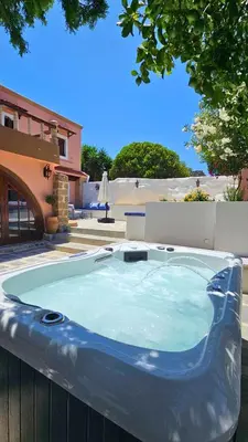 a large hot tub sitting in a yard at Old Town Pearl in Rhodes Town