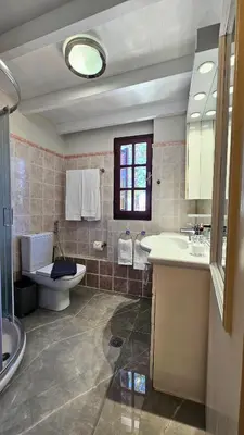 a bathroom with a toilet and a sink at Old Town Pearl in Rhodes Town