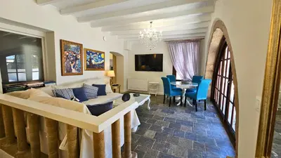 a living room with a couch and a table at Old Town Pearl in Rhodes Town
