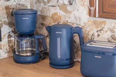 two blue blenders sitting on a counter next to a blender at Hidden Petra Luxury Suites in Ialyssos