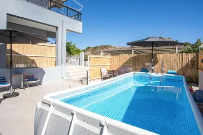 a swimming pool on top of a house at Aelia House in Kalithies