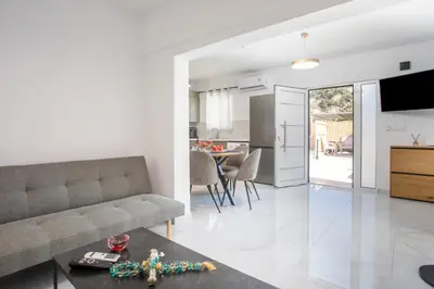 a living room with a couch and a table at Aelia House in Kalithies