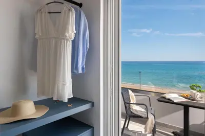 a room with a window with a view of the ocean at Elysian Luxury Residence in Vrachonisída touArchangélou