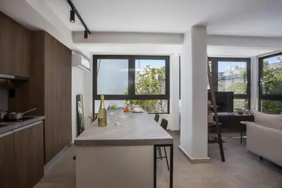 a kitchen with a island in the middle of a room at The Keep38 in Rhodes Town