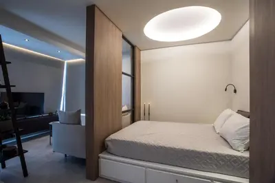 a small bedroom with a bed and a window at The Keep38 in Rhodes Town